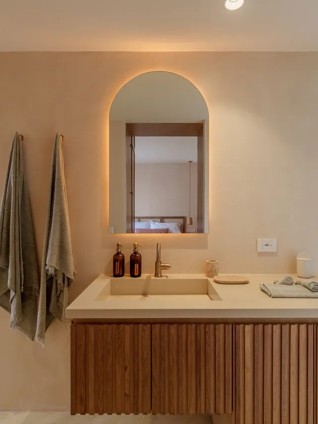 Warm, modern bathroom vanity at Aflora D403