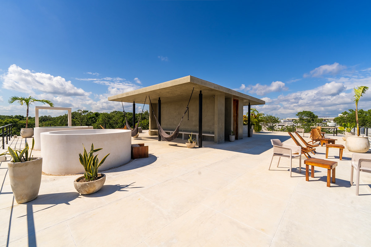 Open rooftop terrace with seating and a small pavilion — Seremonia Origen